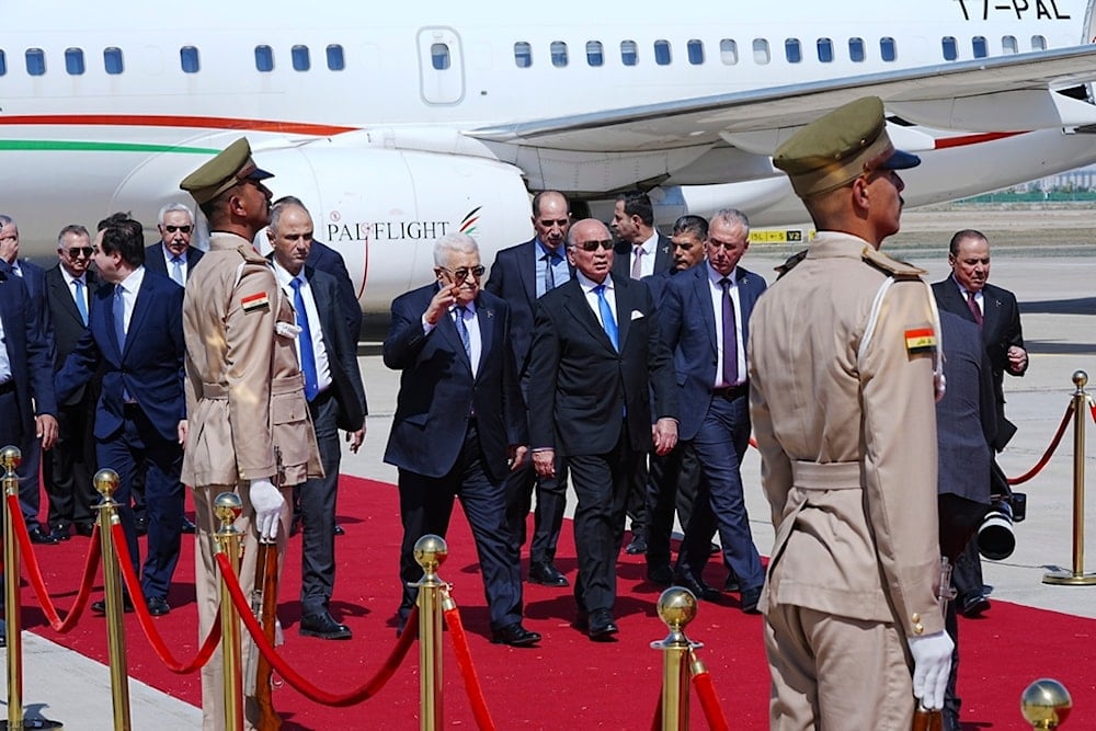 Iraqi Foreign Minister Fuad Hussein welcomes Palestinian President Mahmoud Abbas at Baghdad International Airport ahead of the 34th Arab League summit, in Baghdad, Iraq, Friday, May 16, 2025 (AP)