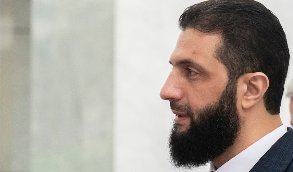 Syria's interim leader, Ahmad al-Sharaa, walks in the presidential palace ahead of a meeting in Damascus, Dec. 28, 2024. (AP)