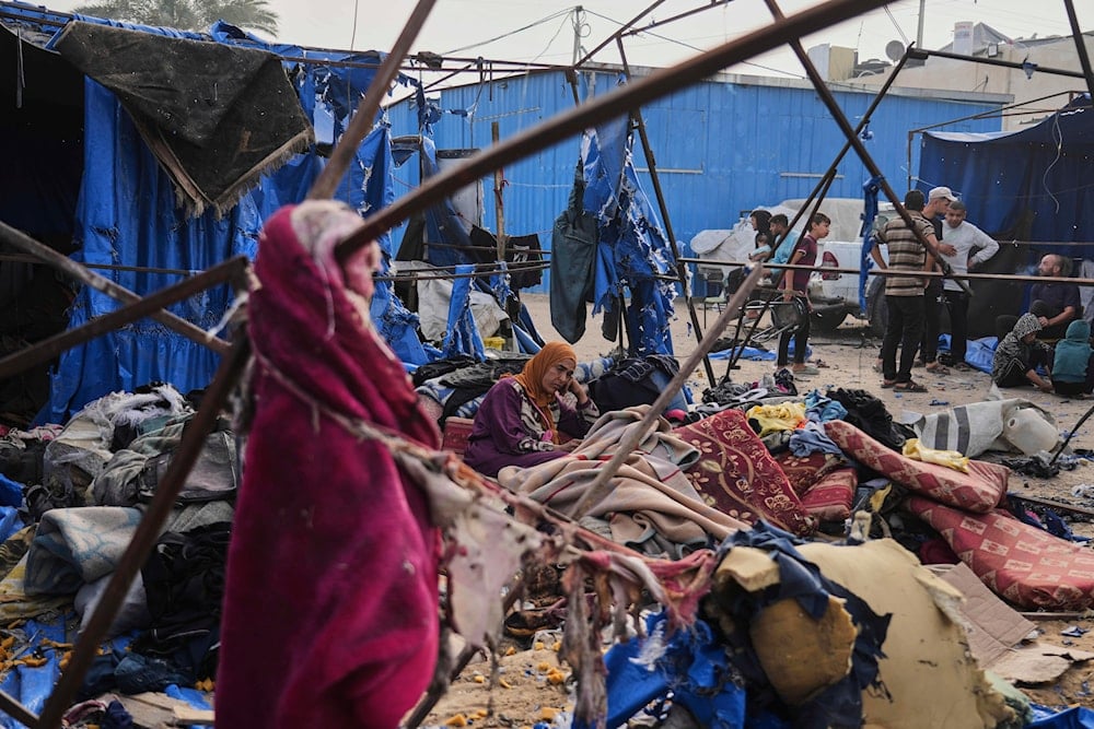 Palestinians inspect the damage caused by an Israeli airstrike that struck tents at Al-Aqsa Hospital in Deir al-Balah, central Gaza Strip, Saturday, May 17, 2025. (AP)