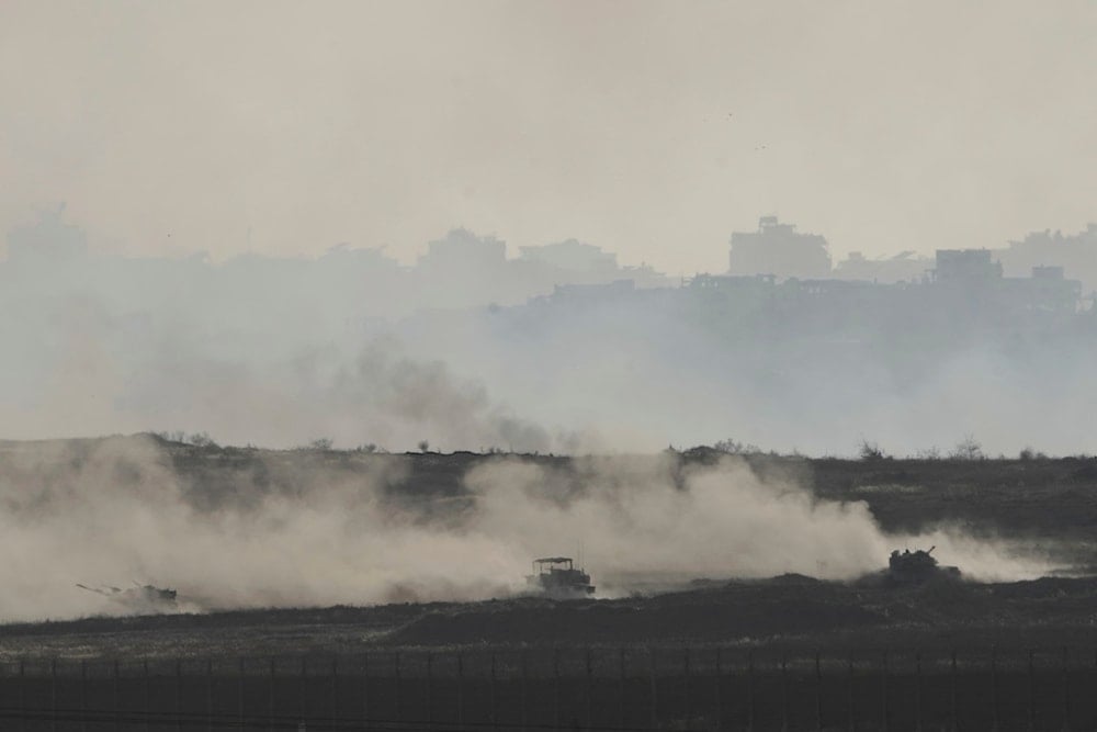 Israeli tanks manoeuvre in Gaza, as seen from southern occupied Palestine, right outside of Gaza, Friday, May 16, 2025 (AP)