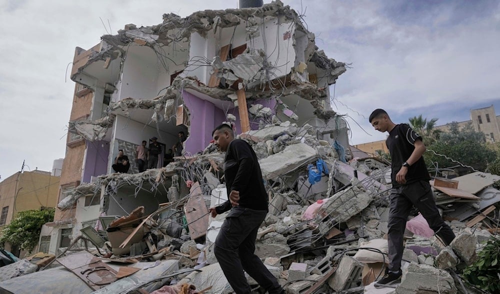 Palestinians inspect a house destroyed by the Israeli army during a raid that killed five Palestinian militants in the West Bank village of Tamun, Thursday, May 15, 2025. (AP)
