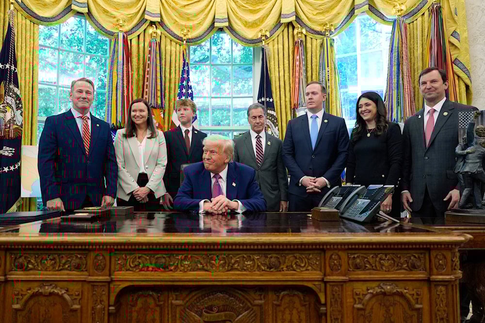 US President Donald Trump speaks with reporters as he signs an executive order in the Oval Office of the White House, Friday, May 9, 2025, in Washington. (AP)
