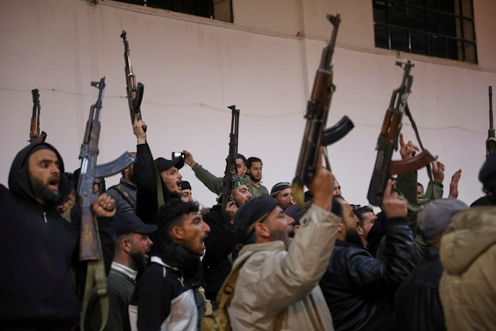 Soldiers from the 70th Division of the New Syrian Army during an Iftar organized by the Ministry of Defense at a military site in Damascus, Monday, March 24, 2025 (AP)