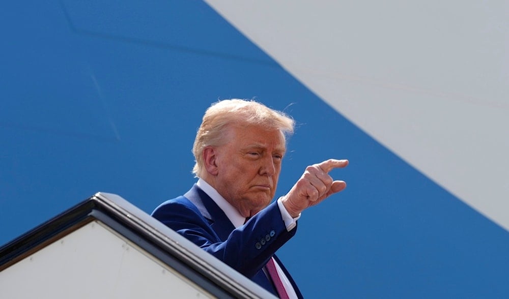 US President Donald Trump gestures as he boards Air Force One to depart Al Udeid Air Base, Thursday, May 15, 2025, in Doha, Qatar. (AP)