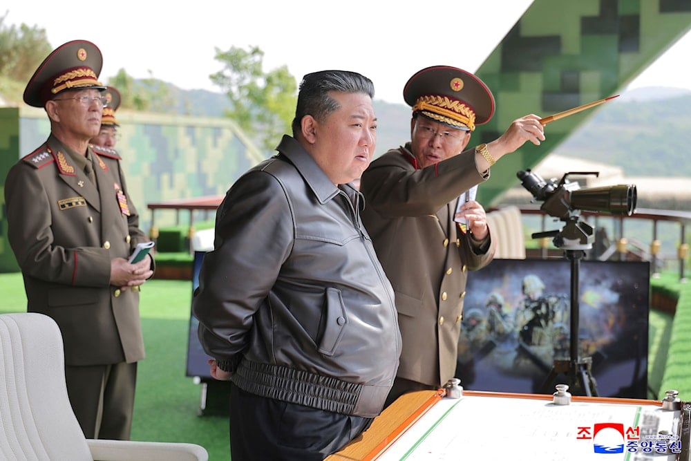 In this photo provided by the DPRK government, DPRK Kim Jong Un, center, inspects the military exercises at an undisclosed place in DPRK, Tuesday, May 13, 2025. (Korean Central News Agency/Korea News Service via AP)