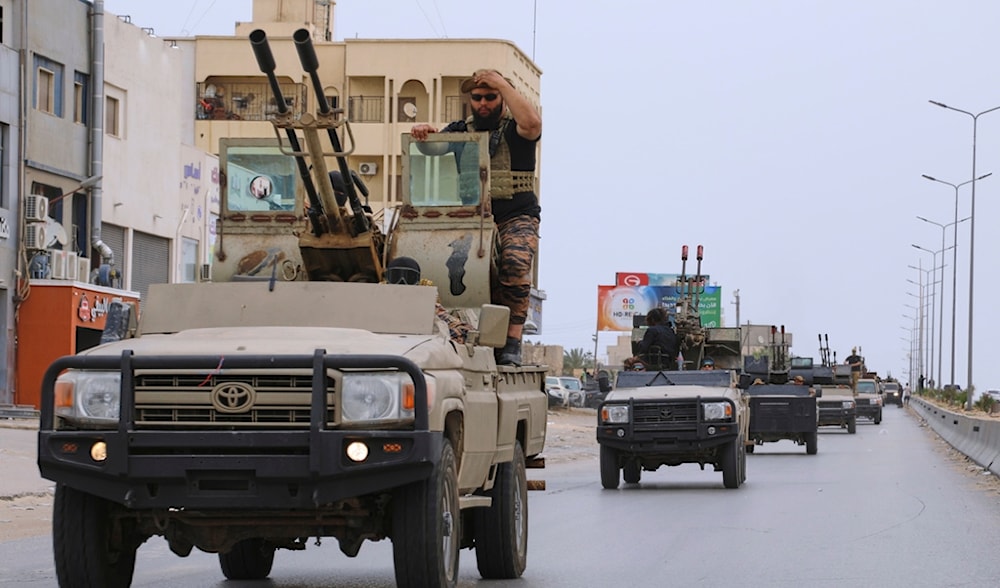 Libyan armored vehicles patrol after clashes between heavily armed militias in Tripoli, Libya, Wednesday, May 14, 2025.(AP)