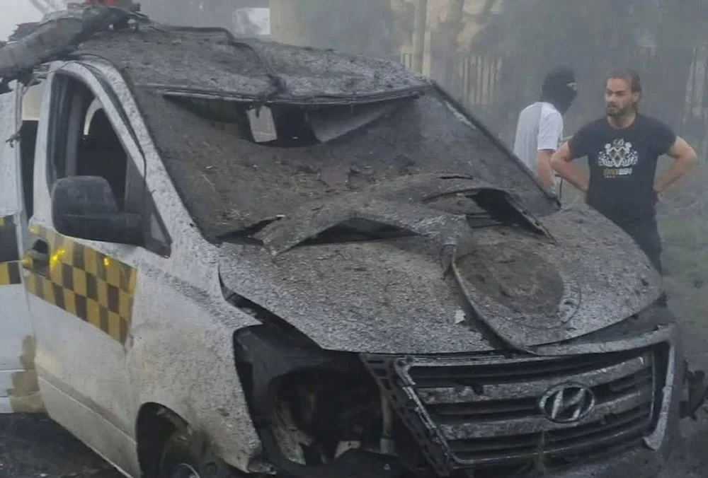 A vehicle damaged after a car bomb was detonated in Deir Ezzor, eastern Syria, May 18, 2025 (Social media)