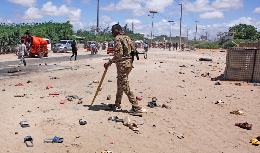 Security officer patrol near the scene of a suicide bomber attack in Mogadishu, Somalia Sunday, May 18, 2025. (AP)