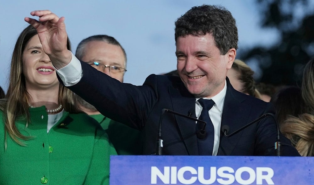Presidential candidate Nicusor Dan speaks to media after polls closed for the second round of the country's presidential election redo in Bucharest, Romania, Sunday, May 18, 2025. (AP)