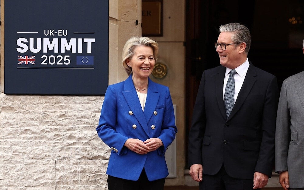 Britain's Prime Minister Keir Starmer (right) poses with European Commission President Ursula von der Leyen at the UK-EU Summit at Lancaster House in London on May 19, 2025. (Pool/AFP)