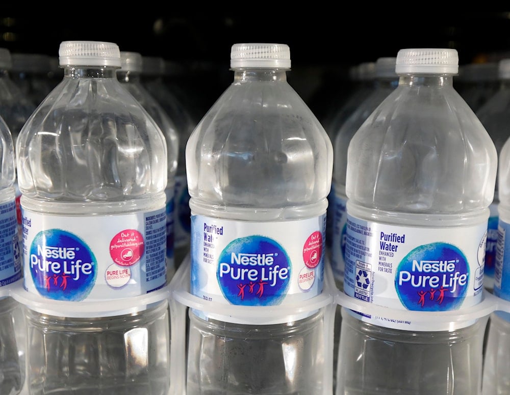 In this Sept. 21, 2018, file photo, is a closeup of pint bottles of purified water, Pure Life, manufactured by Nestle, on sale in a Ridgeland, Miss., convenience store. (AP)