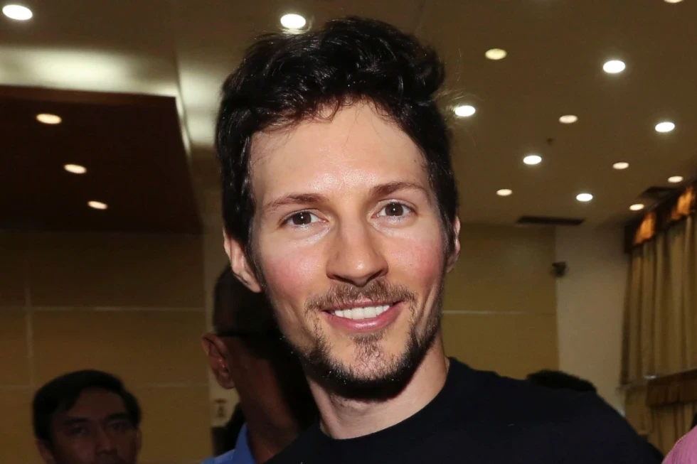 Telegram co-founder Pavel Durov, center, smiles following his meeting with Indonesian Communication and Information Minister Rudiantara in Jakarta, Indonesia on Aug. 1, 2017 (AP Photo/Tatan Syuflana)