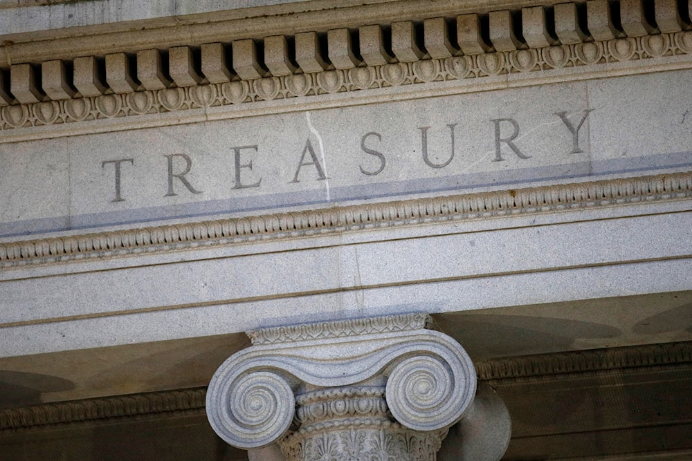 This photo shows the US Treasury Department building at dusk in Washington, June 6, 2019. (AP)