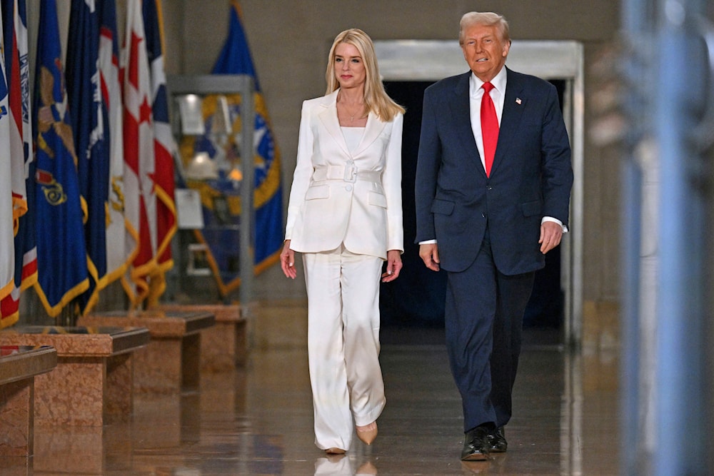 President Donald Trump arrives with Attorney General Pam Bondi to speak at the Justice Department in Washington, Friday, March 14, 2025 (AP)
