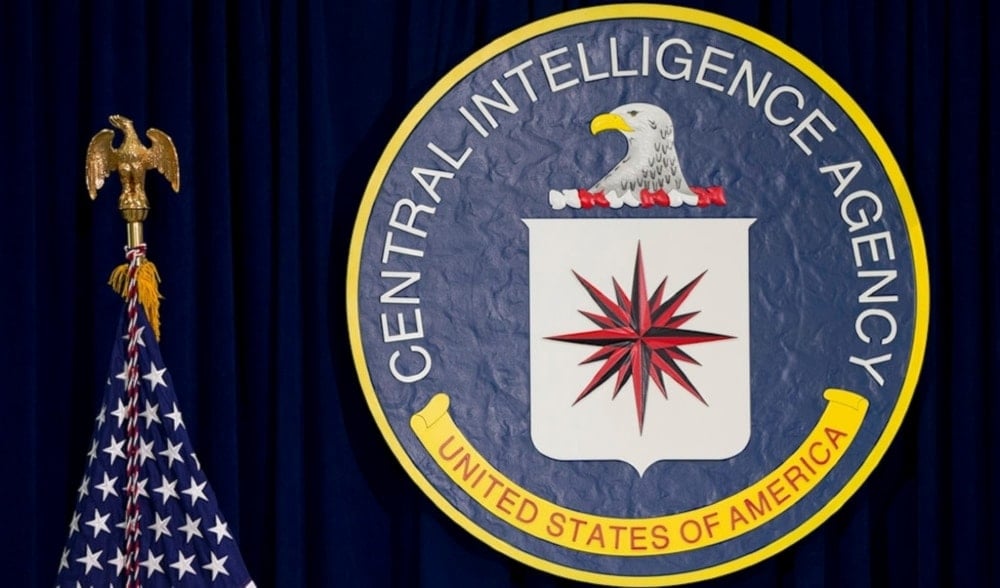 The Central Intelligence Agency logo appears next to the flag of the United States of America in this undated photo (Carolyn Kaster/AP)