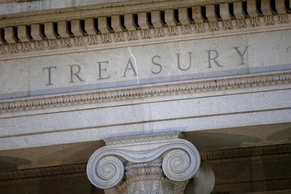This June 6, 2019, a file photo shows the US Treasury Department building at dusk in Washington (AP)