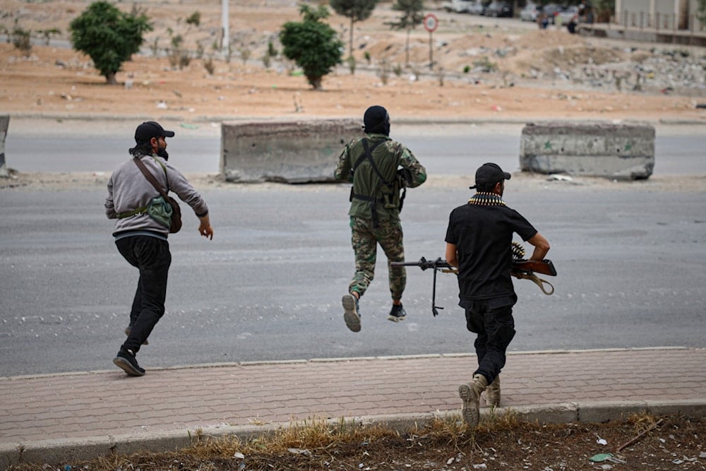 Members of Syria's security forces deploy as a sniper fires during an operation on the outskirts of the town of Sahnaya, south of Damascus, Wednesday, April 30, 2025 (AP)