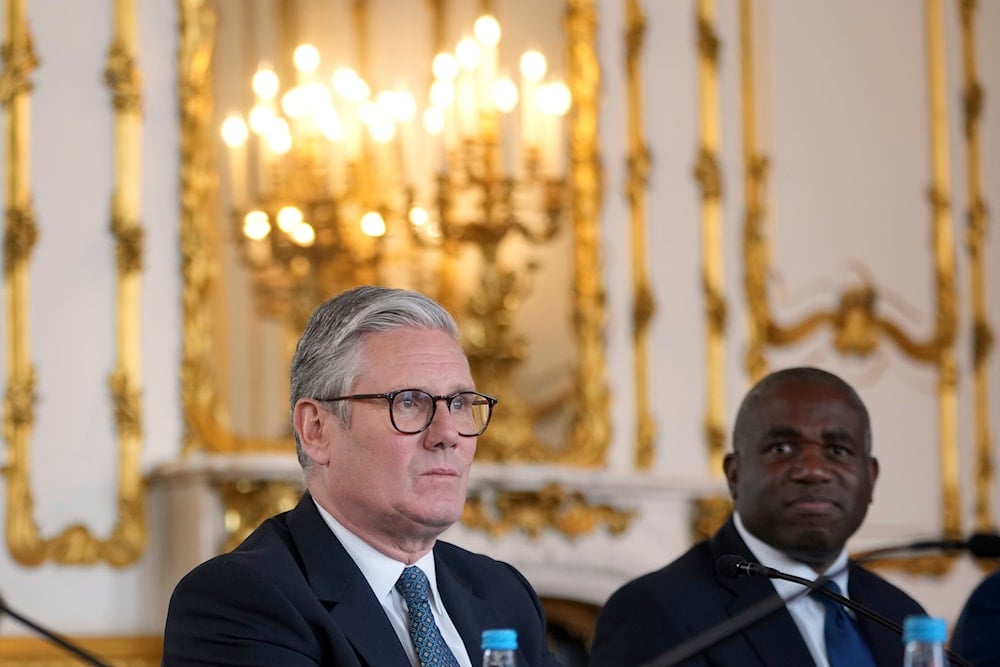 Britain's Prime Minister Keir Starmer and Foreign Secretary David Lammy listen during a meeting between the UK and the European Union to discuss closer ties, London, Monday, May 19, 2025 (AP)