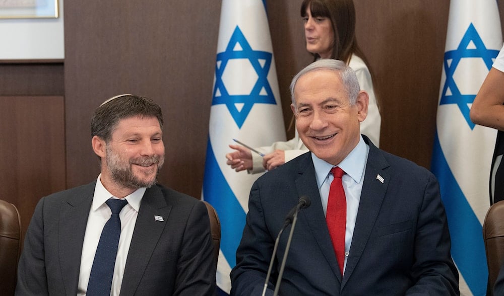 Israeli Prime Minister Benjamin Netanyahu and Israeli Minister of Finance Bezalel Smotrich, attend a weekly cabinet meeting in the prime minister's office in Al-Quds, Sunday, June 18, 2023 (AP)