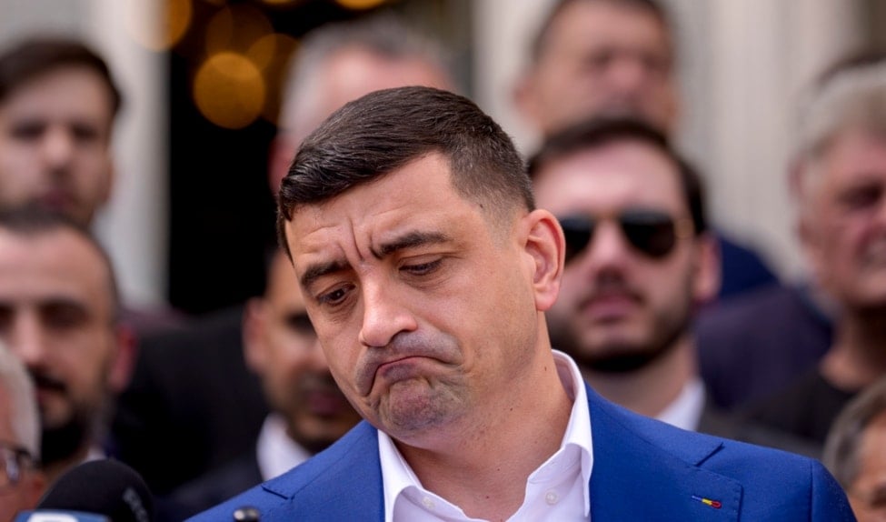 George Simion grimaces as he speaks with foreign media, during the second round of the country's presidential election redo, in Bucharest, Romania, Sunday, May 18, 2025. (AP)