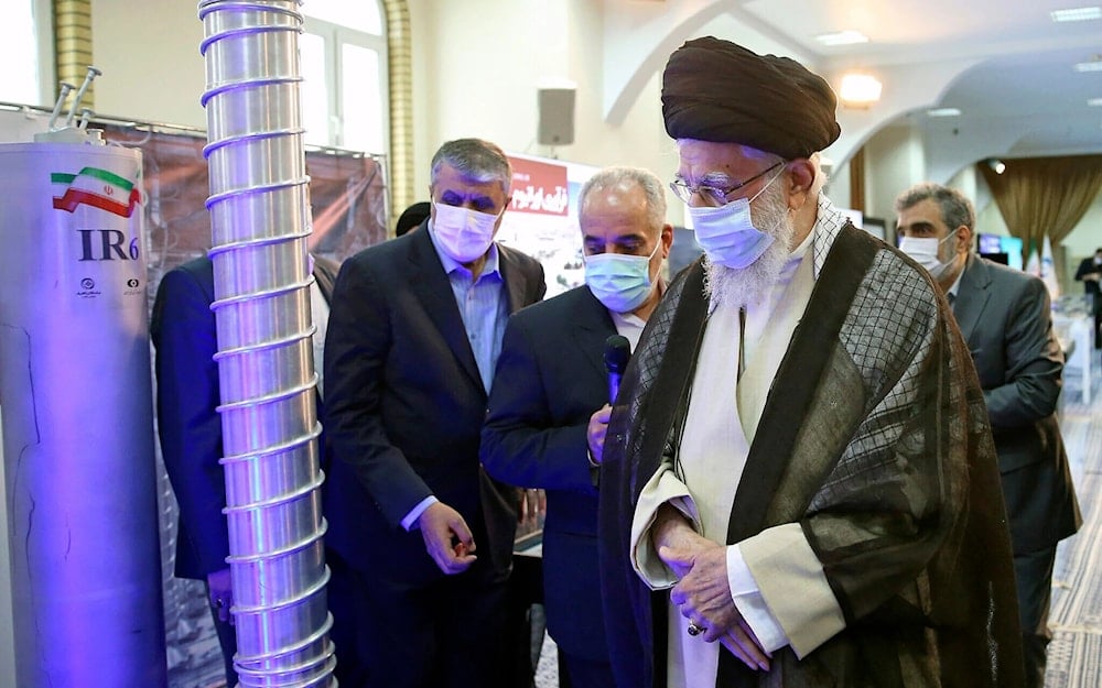 Iranian leader Ayatollah Ali Khamenei, right, visits an exhibition of the country’s nuclear achievements, at his office compound in Tehran, Iran, June 11, 2023. (Office of the Iranian leader, via AP)