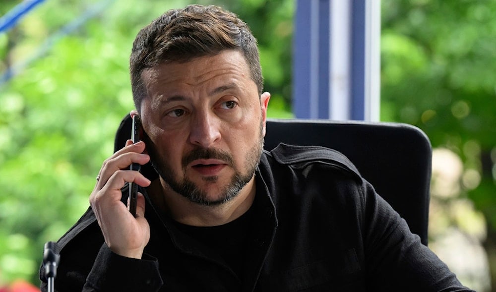 Ukraine's President Volodymyr Zelensky speaks on the phone during a meeting at the European Political Community summit in Skanderbeg Square in Tirana, Albania, on Friday, May 16, 2025. (AP)