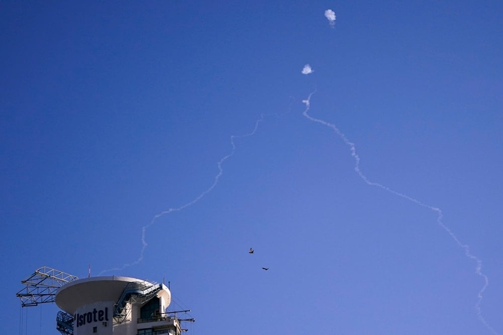 The Israeli Iron Dome anti-missile system fires to intercept as air raid sirens sound in Tel Aviv, on October 23, 2024 (AP)