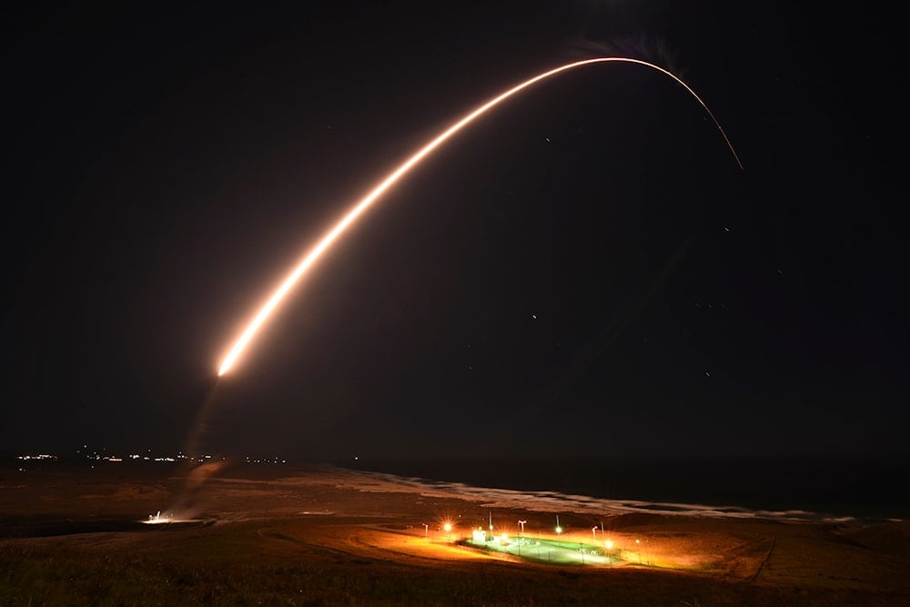 In this photo released by the U.S. Army Space and Missile Defense Command, an unarmed Minuteman 3 intercontinental ballistic missile launches during an operation test at Vandenberg Air Force Base, Calif., on Tuesday, Feb. 23, 2021 (AP)