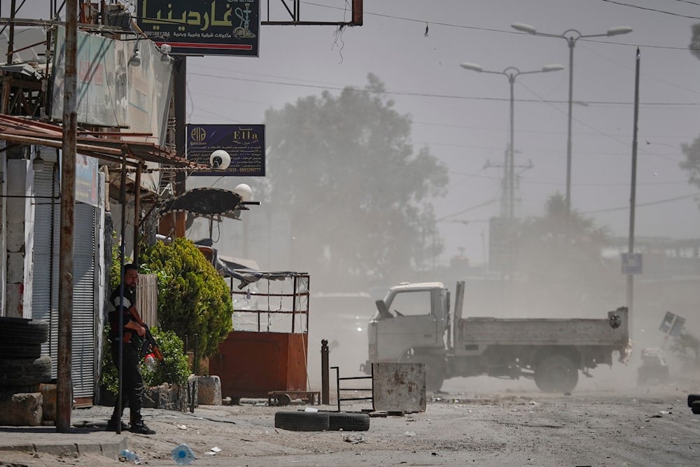 A Druze gunmen stands guard near a checkpoint a day after clashes between members of the minority Druze sect and pro-government fighters left at least four people dead in the southern suburb of Jaramana, Damascus, Syria, Tuesday, April 29, 2025 (AP)