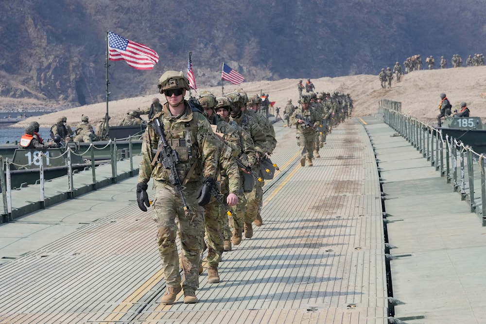 US troops cross a floating bridge on the Imjin River during a joint river-crossing exercise between S. Korea and the US as a part of the Freedom Shield military exercise in Yeoncheon, S. Korea, Thursday, March 20, 2025 (AP)