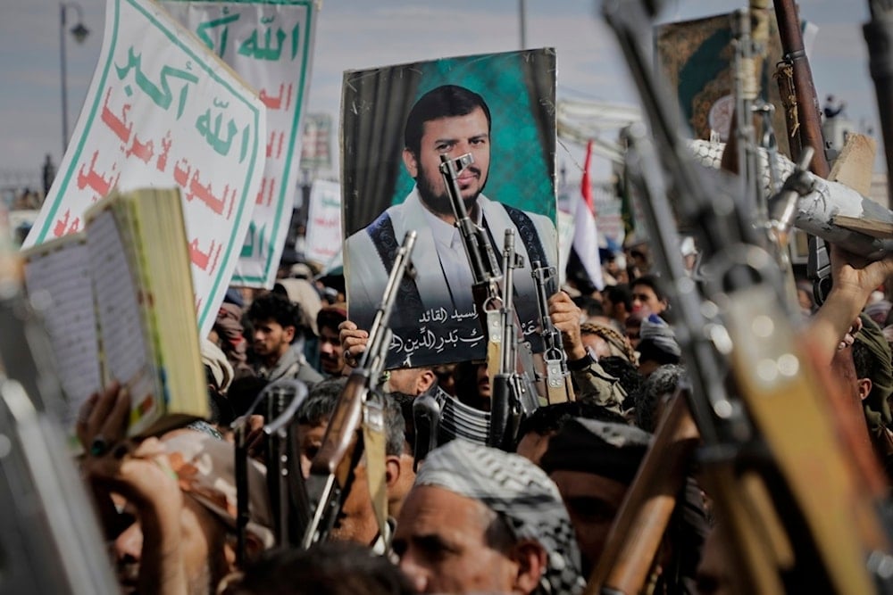 Yemenis chant slogans and hold pictures of Sayyed Abdul Malik al-Houthi, the leader of the Ansar Allah movement, during an anti-US and anti-Israeli rally in Sanaa, Yemen, Monday, March 17, 2025 (AP)