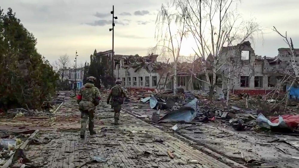vIn this photo taken from video distributed by the Russian Defense Ministry Press Service on Thursday, March 13, 2025, Russian soldiers patrol an area in Sudzha, in the Kursk region of Russia (AP)