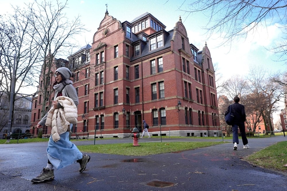 People walk between buildings, Dec. 17, 2024, on the campus of Harvard University in Cambridge, Massachusetts (AP)