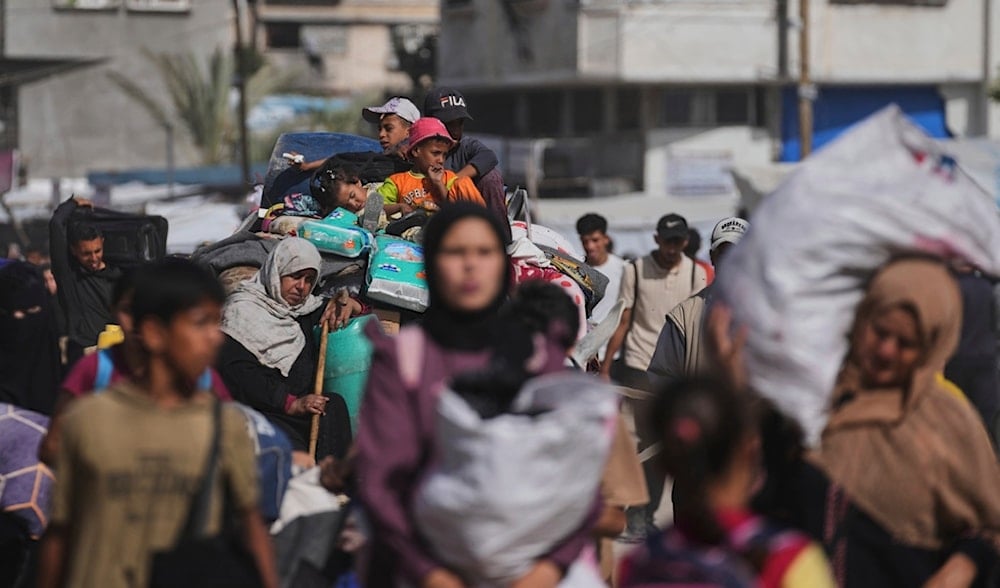Displaced Palestinians flee from Khan Younis, Gaza, amid the ongoing Israeli war, on Monday, May 19, 2025. (AP)