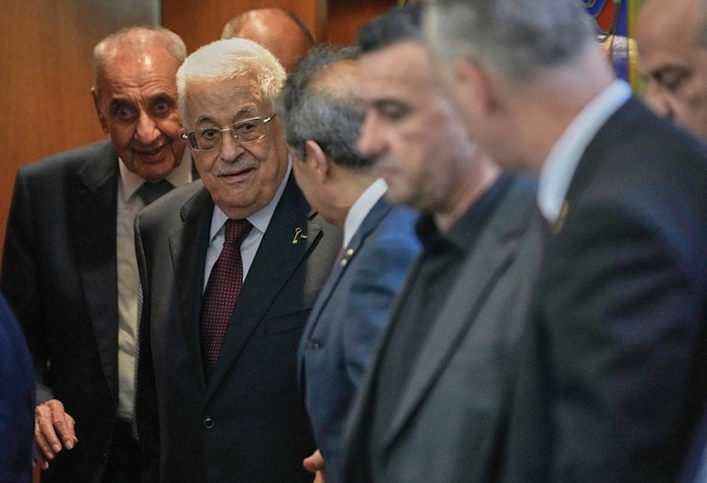 Palestinian President Mahmoud Abbas, centre, leaves after his meeting with Lebanese Parliament Speaker Nabih Berri, left background, in Beirut, Lebanon, Thursday, May 22, 2025 (AP)