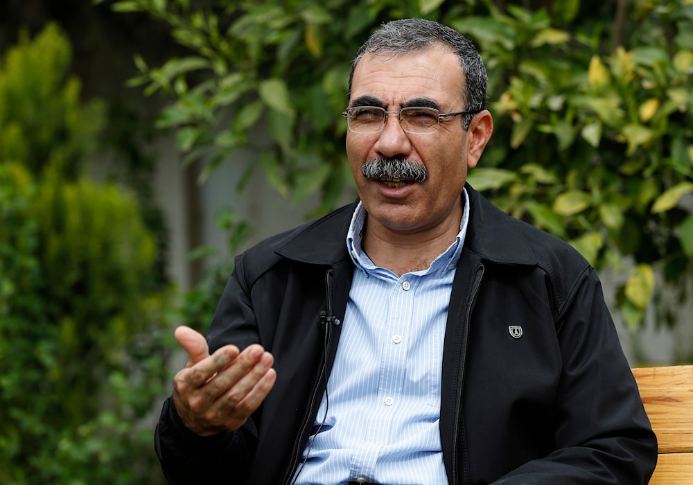In this March 28, 2018 photo, Aldar Khalil, a senior Syrian Kurdish official in Syria, speaks during an interview with The Associated Press, in Amouda, northern Syria. (AP)