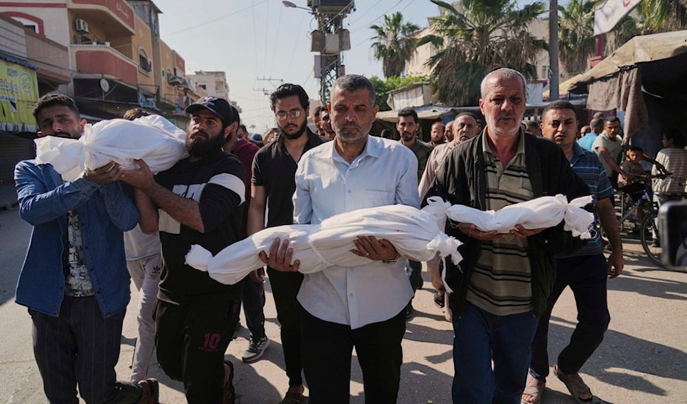 Palestinian carry the bodies of their relatives including children who were killed in an Israeli army airstrike in Deir al-Balah, Gaza, Wednesday, May 21, 2025. (AP)