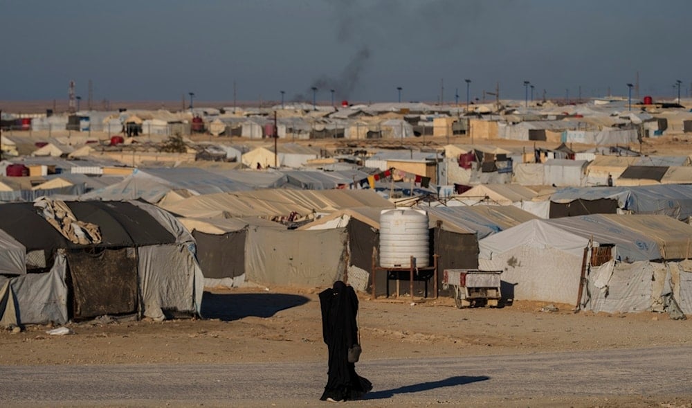 A woman walks in the al-Hol camp in northeastern Syria's Hasakeh province, Thursday, Jan. 30, 2025. (AP)