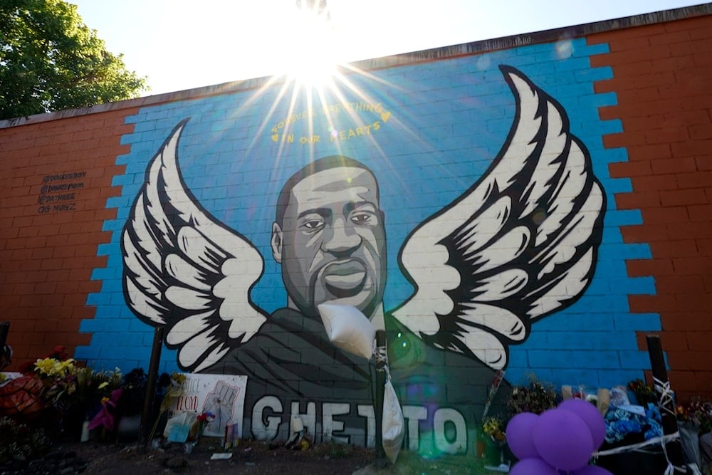 The sun shines above a mural honoring George Floyd in Houston's Third Ward on Sunday, June 7, 2020. (AP)