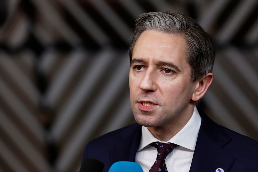 Ireland's Prime Minister Simon Harris speaks with the media as he arrives for an EU summit at the European Council building in Brussels, Thursday, Dec. 19, 2024 (AP)