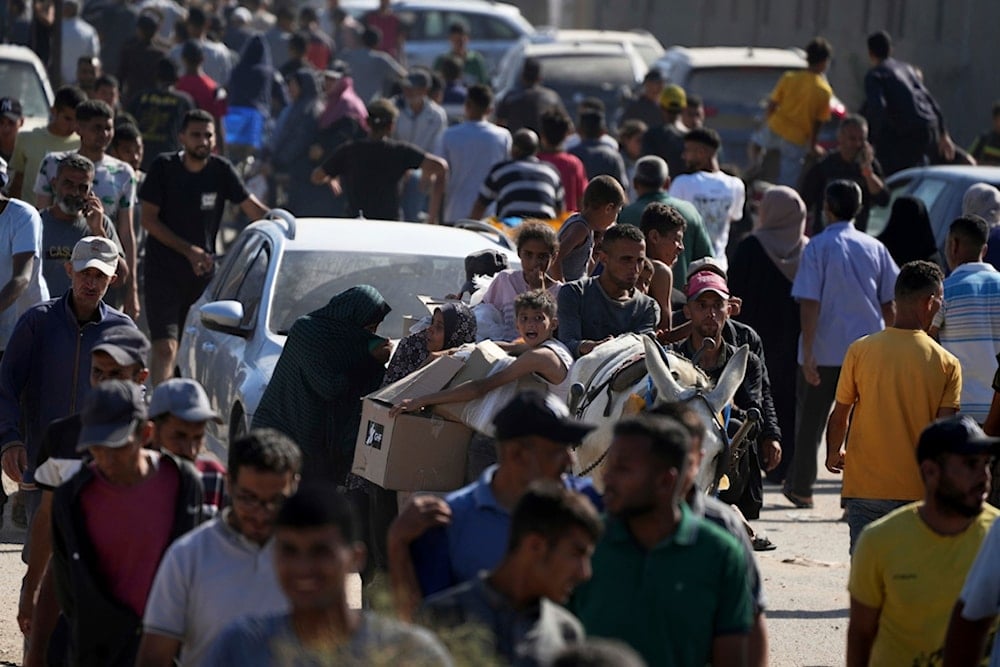 Palestinians heading to receive food and humanitarian aid packages from the Gaza Humanitarian Foundation, a US-backed group, in Rafah, southern Gaza Strip on Tuesday, May 27, 2025 (AP)