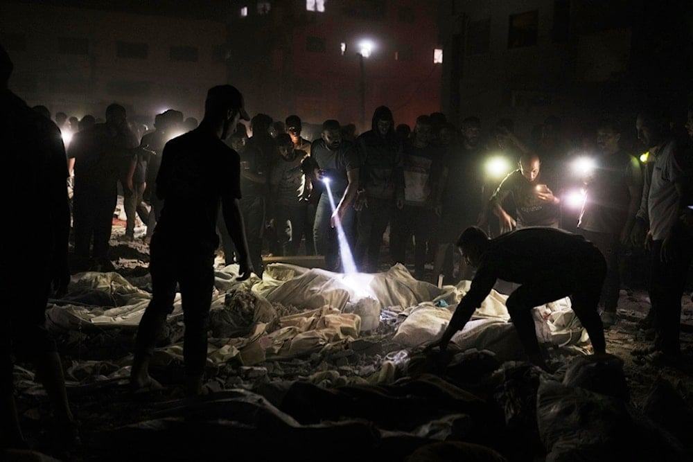 Palestinians inspect a site used as a shelter for displaced residents that was hit by an Israeli military strike, in Gaza City, on Sunday, May 25, 2025 (AP)