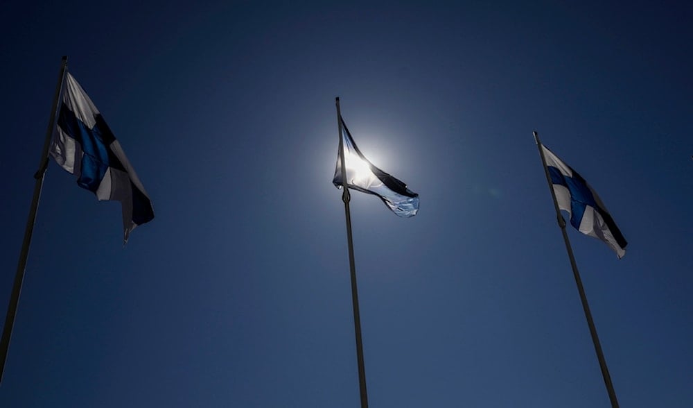 NATO and Finland flags flutter over the building of Ministry of Foreign Affairs in Helsinki, Finland, Tuesday, April 4, 2023 (AP)