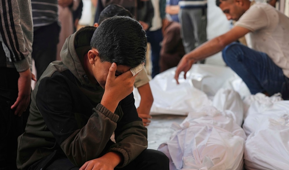 Palestinians mourn their relatives who were killed in an Israeli airstrike on the Gaza Strip, at the Al-Aqsa Hospital in Deir al-Balah, Gaza, Wednesday, May 28, 2025. (AP)