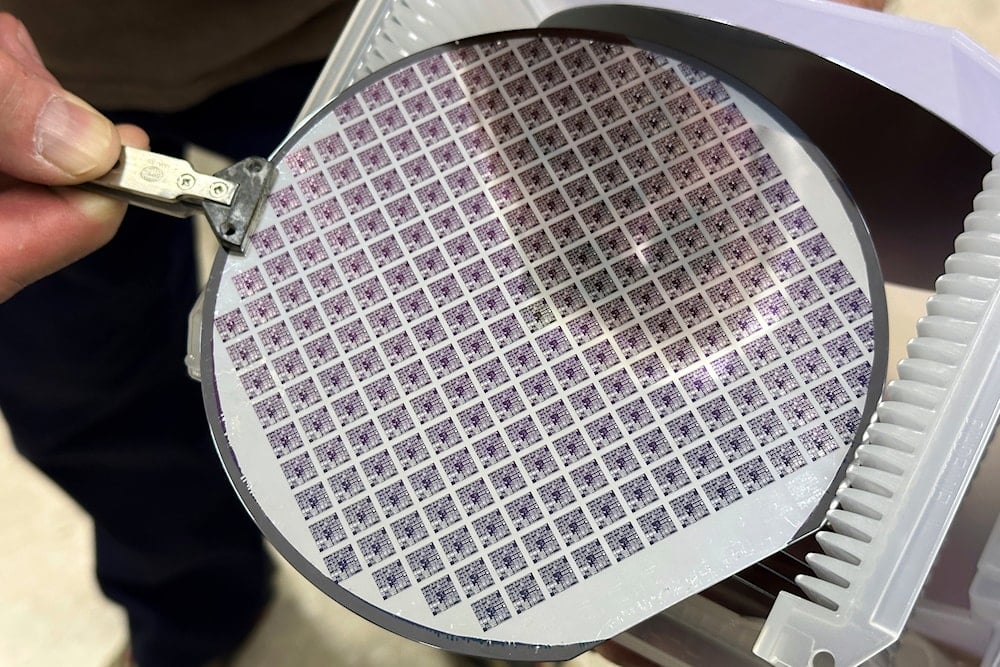 A semiconductor silicon wafer fabricated with multiple microchip microprocessors is at the school of microelectronic engineering at the Rochester Institute of Technology in Henrietta, NY, on Monday, April 14, 2025 (AP)