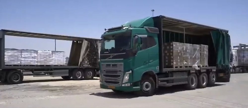 Barely-filled trailers in an ostentatious performance of “aid”, May 20, 2025 (via COGAT on X)