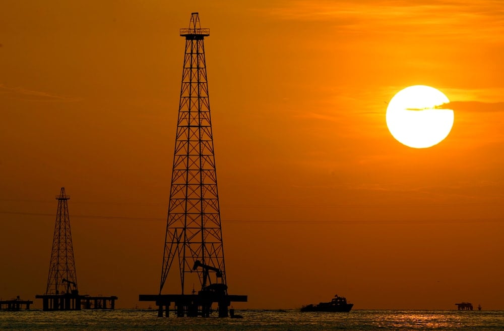  This Nov. 30, 2006 file photo shows oil drills in Maracaibo Lake in Venezuela's oil rich Zulia state. 