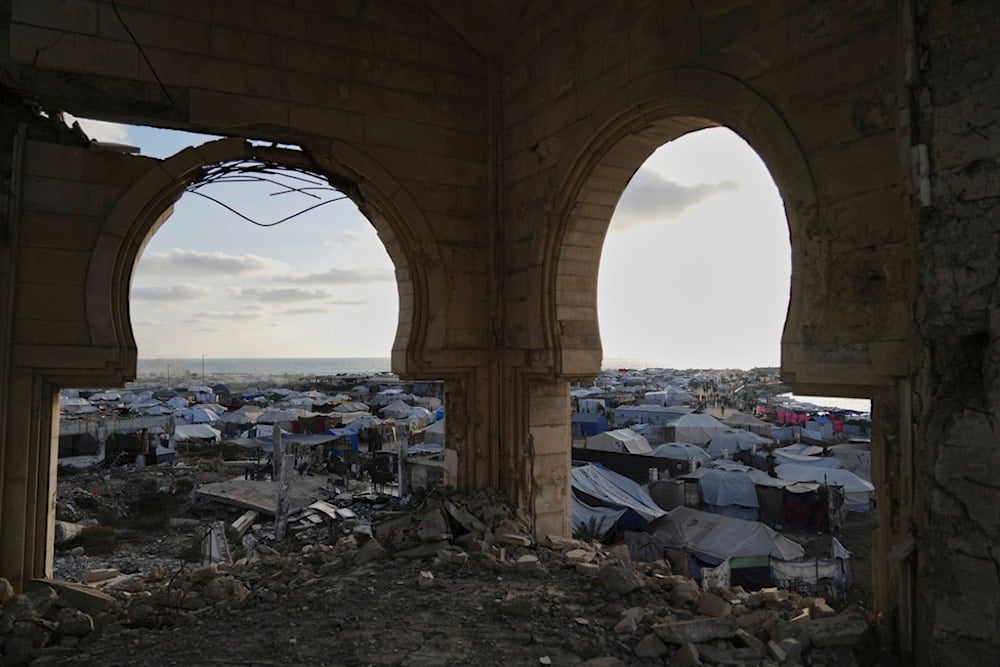 A makeshift tent camp for displaced Palestinians stretches across the port of Gaza City on Thursday, May 22, 2025 (AP)