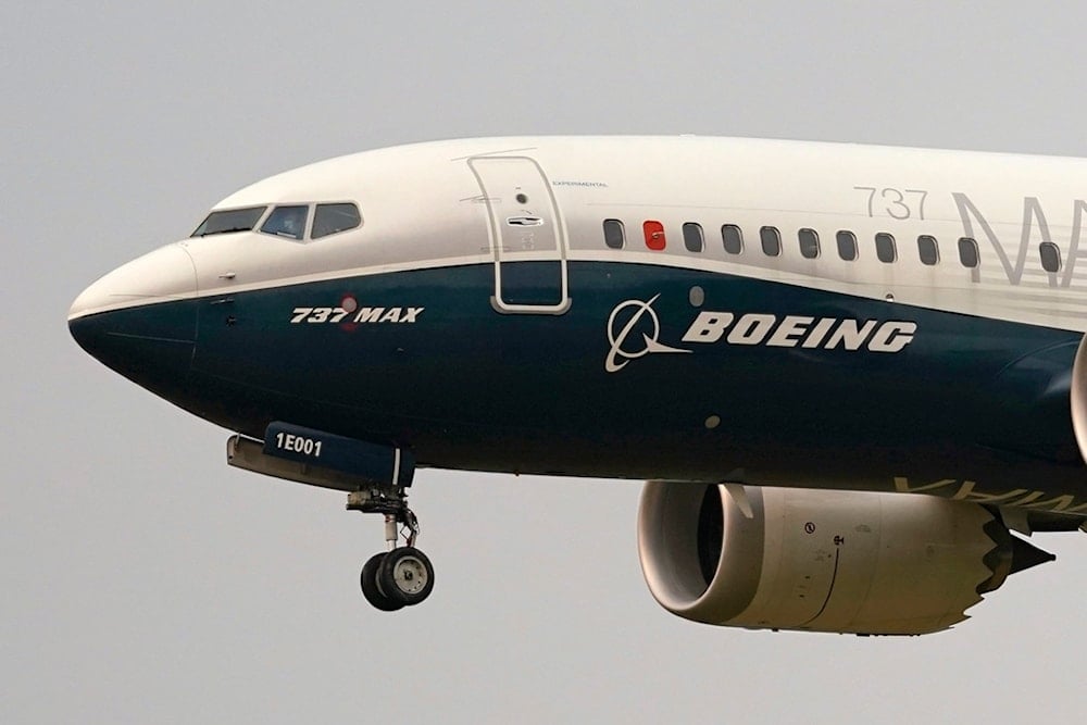 A Boeing 737 Max jet prepares to land at Boeing Field following a test flight in Seattle, September 30, 2020 (AP)