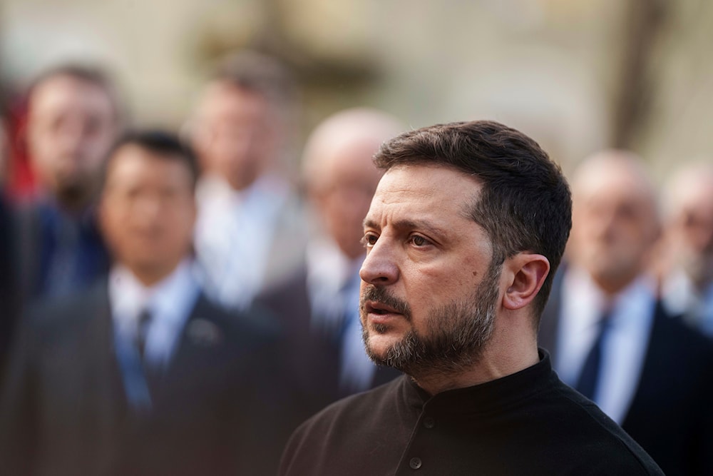 President Volodymyr Zelenskyy answers journalists' questions near a house destroyed by Thursday's Russian strike on a residential neighborhood in Kyiv, Ukraine, on Friday, April 25, 2025 (AP)